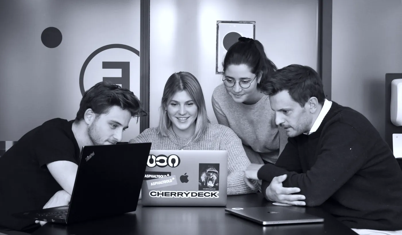 A media team reviewing campaign performance together
